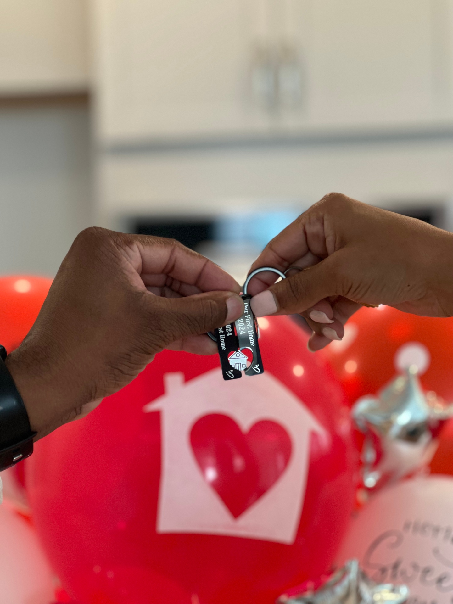 Elisha handing keys to new homeowners